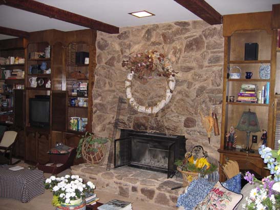 Before photo of a basic stone fireplace